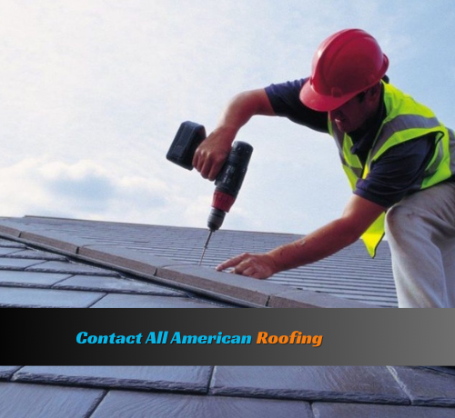 Roofing professional working on roof repair, shown standing on the roof and actively fixing damaged areas. The worker is using roofing tools and appears focused on the repair task.